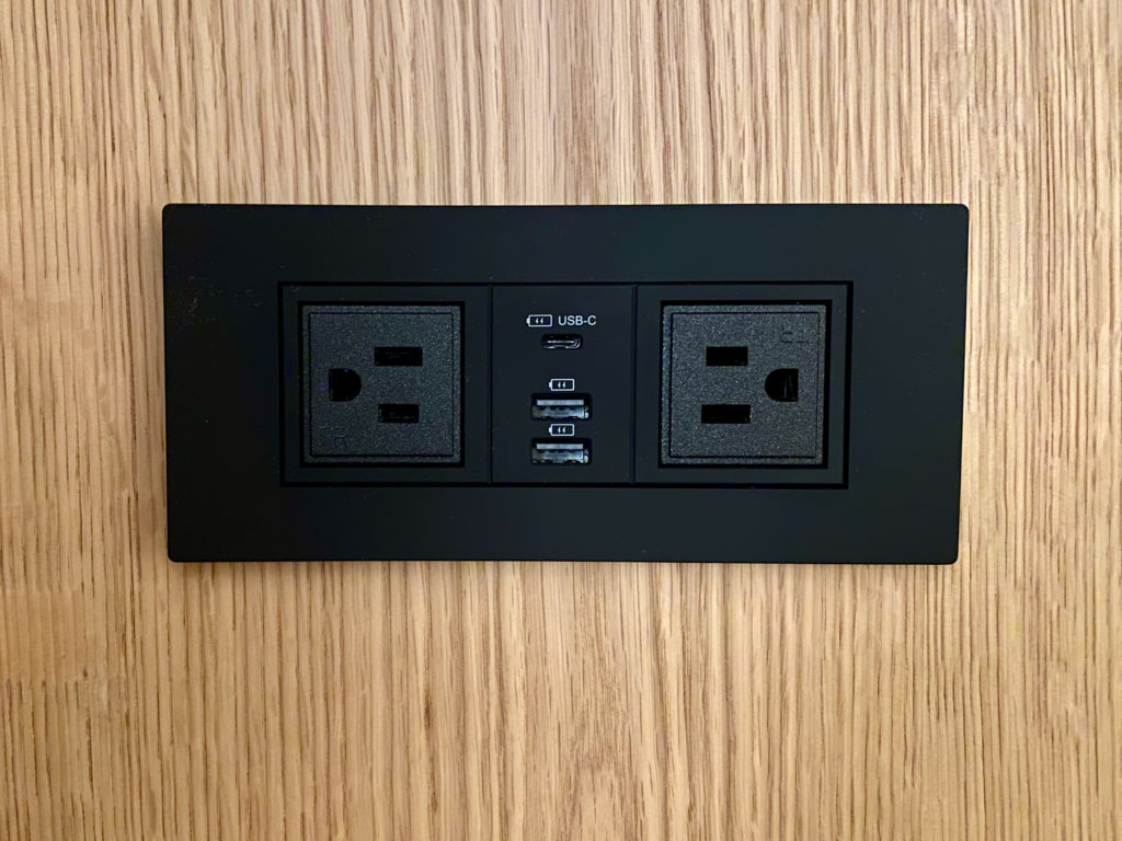 a black rectangular outlet with usb ports