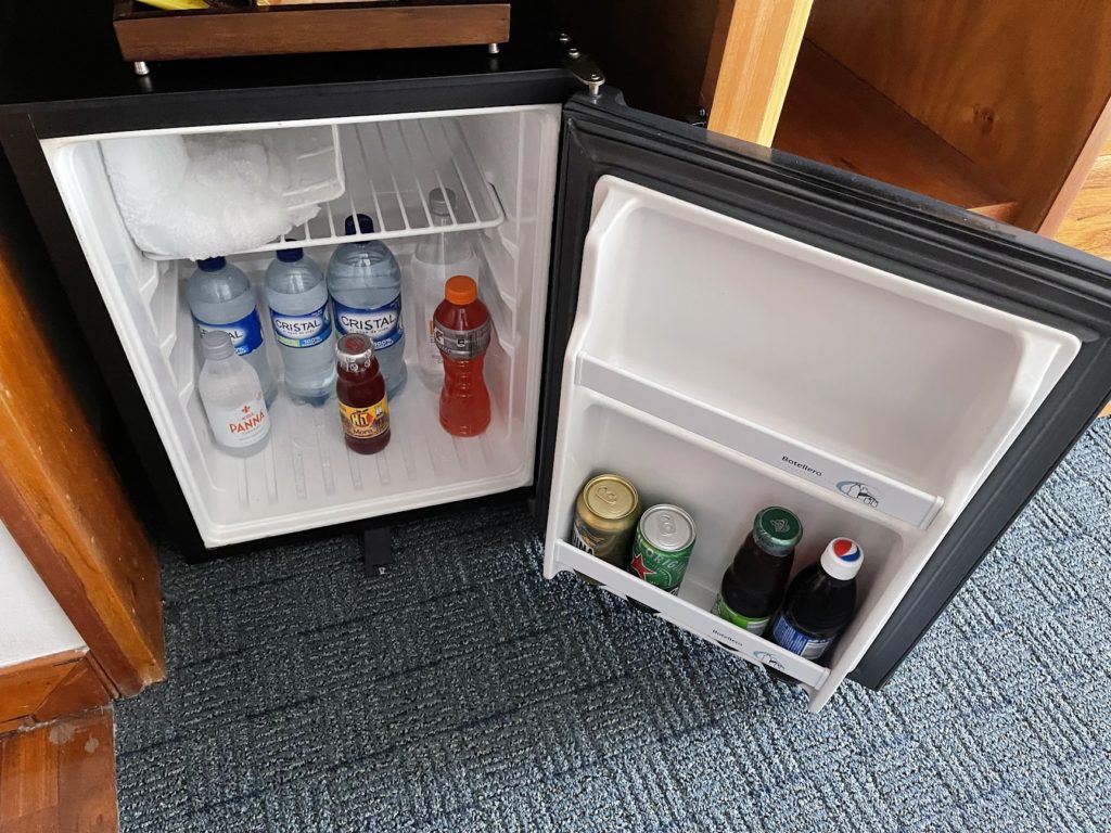 a mini fridge with drinks inside