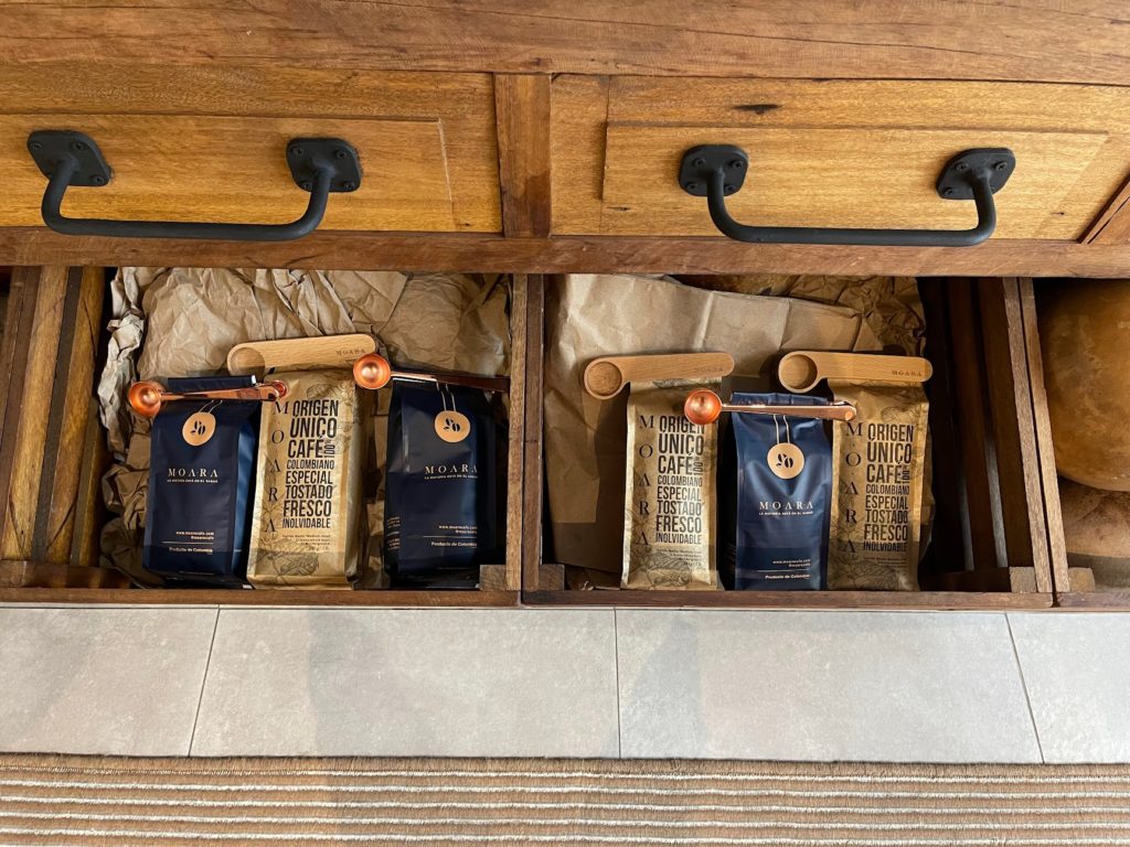 a drawer with several bags of coffee