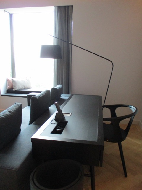 Suite desk with a lamp in a living room