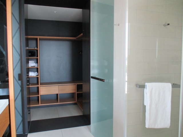 a bathroom with a glass shower door