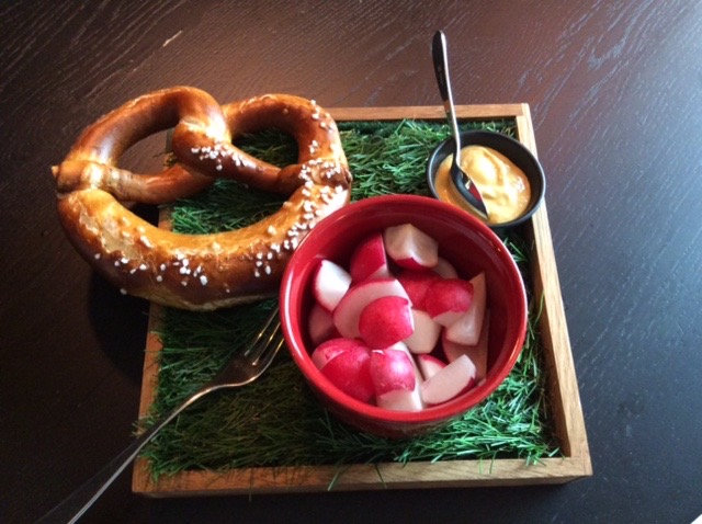Andaz Munich pretzel and salad on a tray
