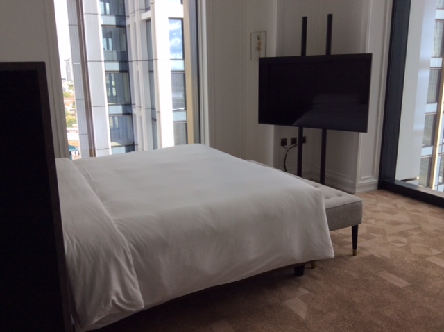Park Hyatt London suite bedroom with two floor to ceiling windows