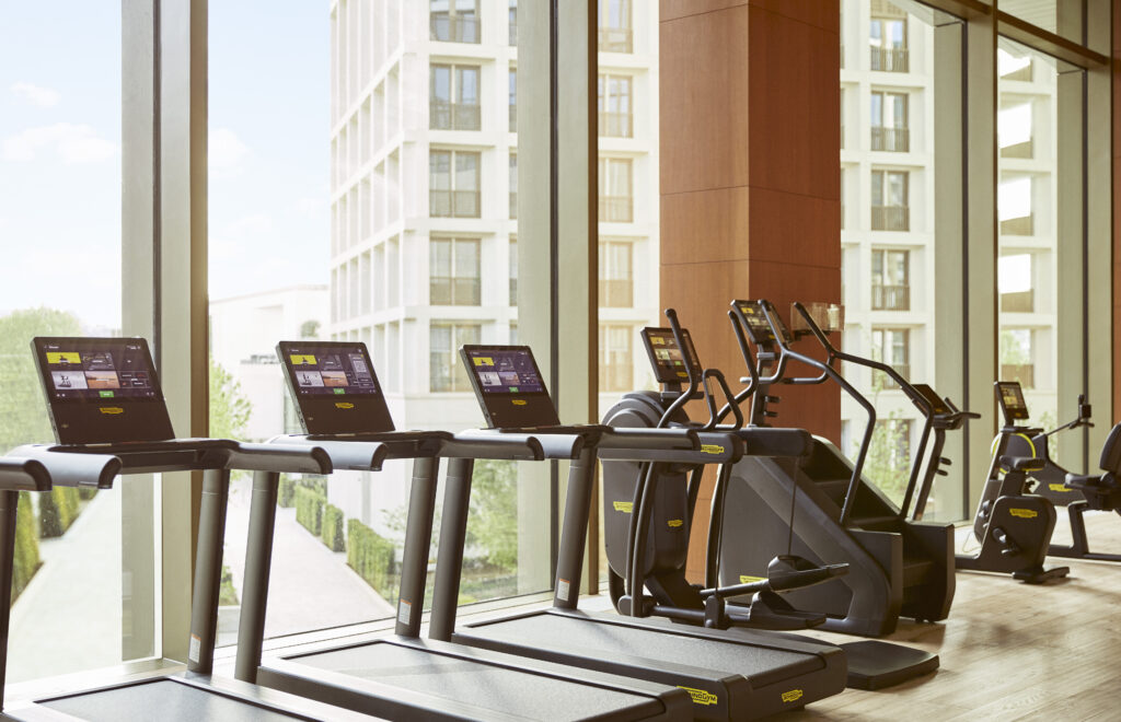 Park Hyatt London gym with treadmills and laptops