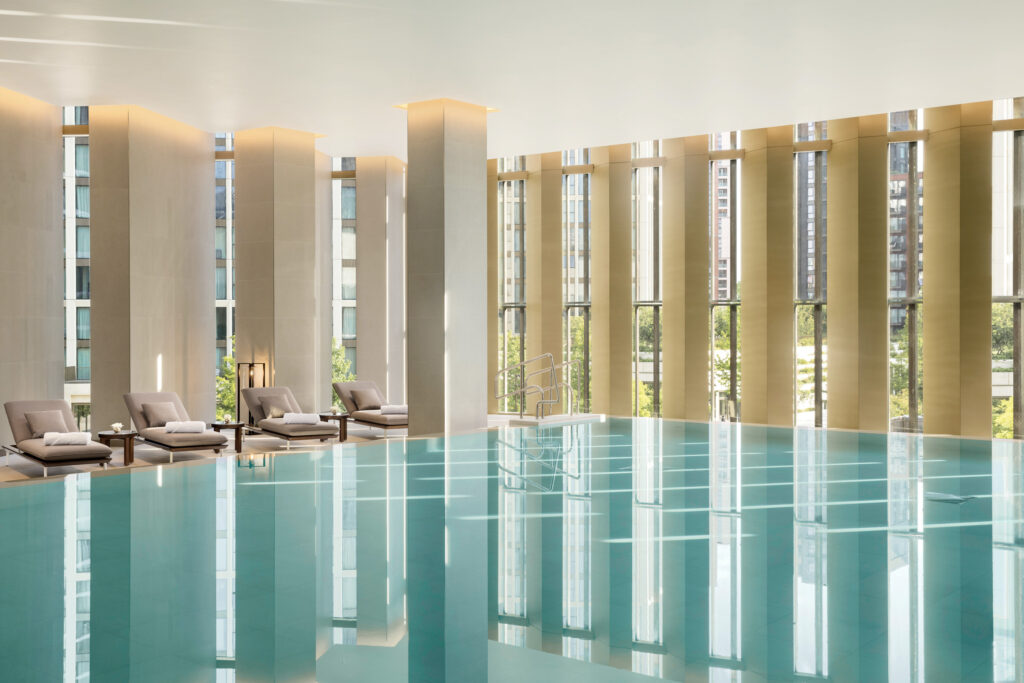 Park Hyatt London large indoor pool with chairs and a large window